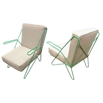 Raoul Guys pair aqua metal chairs