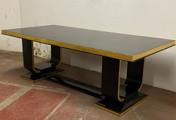 Art deco rarest long gold leaf and black lacquered dinning table