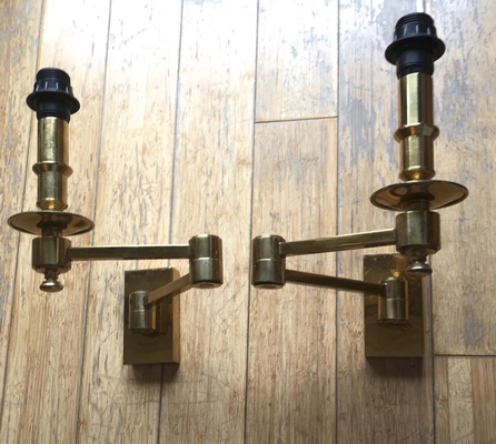 Attributed Maison Jansen refined gold extendable pair of sconces