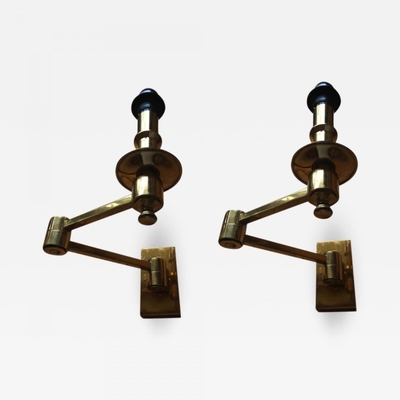 Attributed Maison Jansen refined gold extendable pair of sconces