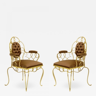 Attributed Rene Prou pair of gold leaf wrought iron arm chairs