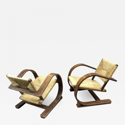 Audoux Minet pair of bent wood lounge chair with a rush cover