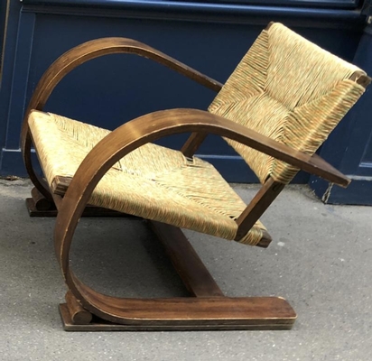 Audoux Minet pair of bent wood lounge chair with a rush cover