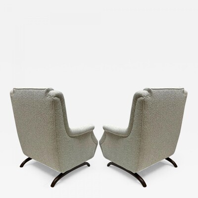 Awesome comfy pair of lounge chairs with horn shaped legs