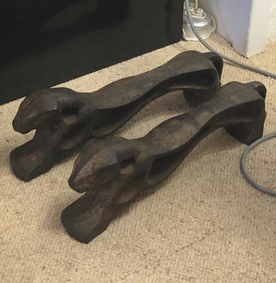 Awesome pair of cheetah shaped solid iron andirons