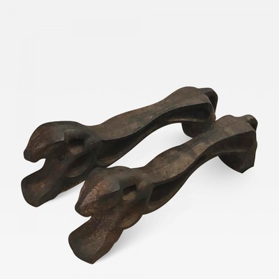 Awesome pair of cheetah shaped solid iron andirons