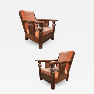 Charles Dudouyit documented pair of rare carved oak lounge chairs