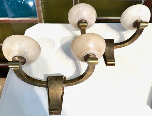 Genet Michon refined bronze and alabaster pair of sconces