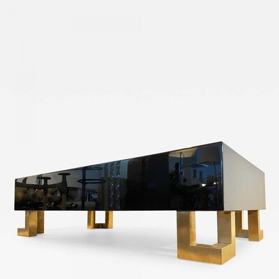 Guy Lefebre pure black lacquered coffee table with gold legs