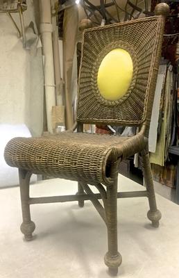 In the style of Jean Royere Set of Ten Rattan Dining Chairs
