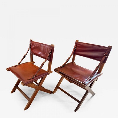Jacques Adnet documented hand stitched leather pair of chairs