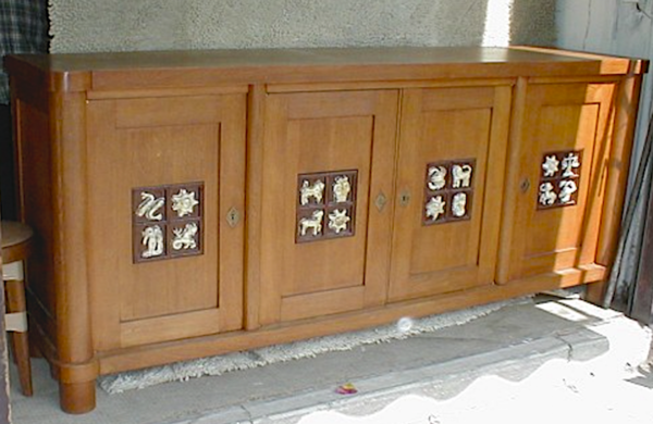 Jacques Adnet rarest oak cabinet with amazing ceramic zodiac sign