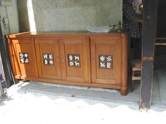 Jacques Adnet rarest oak cabinet with amazing ceramic zodiac sign