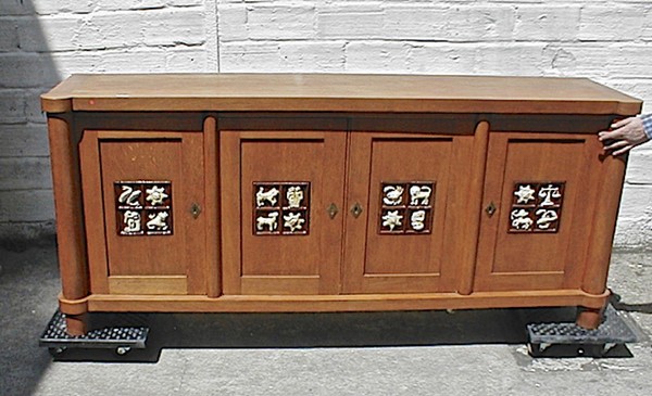 Jacques Adnet rarest oak cabinet with amazing ceramic zodiac sign