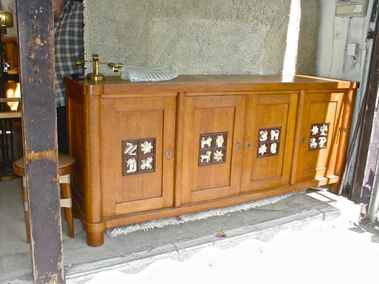 Jacques Adnet rarest oak cabinet with amazing ceramic zodiac sign