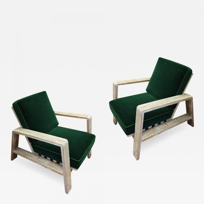 Jean Royere documented pair of cerused oak lounge chairs