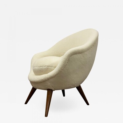 Jean Royere high oeuf chair newly covered in raw white wool