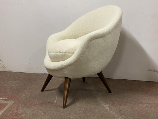 Jean Royere high oeuf chair newly covered in raw white wool