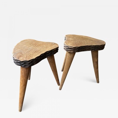 Jean Touret style pair of oak tripod stools carved 
