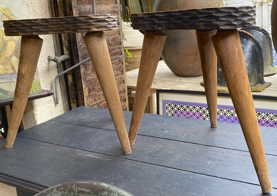 Jean Touret style pair of oak tripod stools carved 