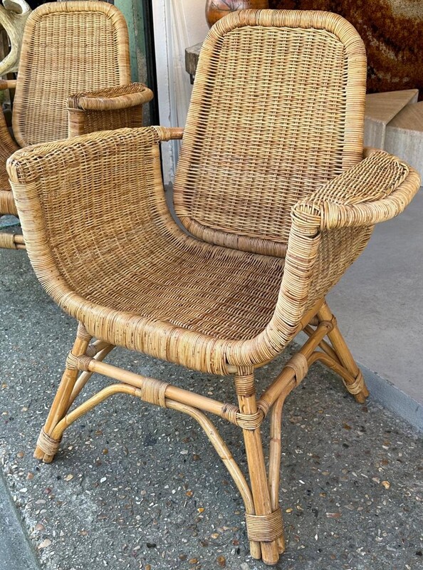 Louis Sognot refined pair of rattan arm chairs in good vintage