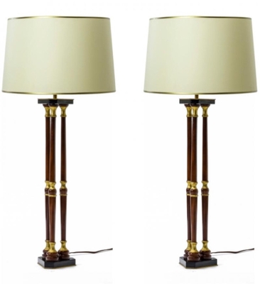 Maison Jansen lacquered wood and gold leaf adorn pair of lamps
