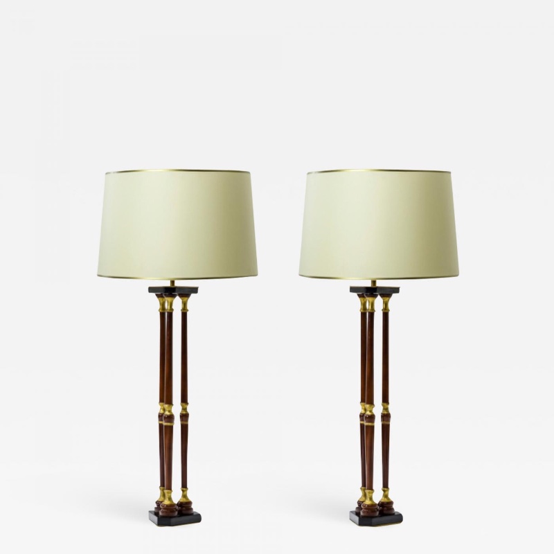 Maison Jansen lacquered wood and gold leaf adorn pair of lamps