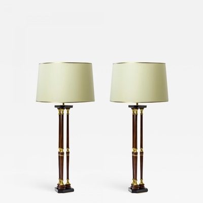Maison Jansen lacquered wood and gold leaf adorn pair of lamps
