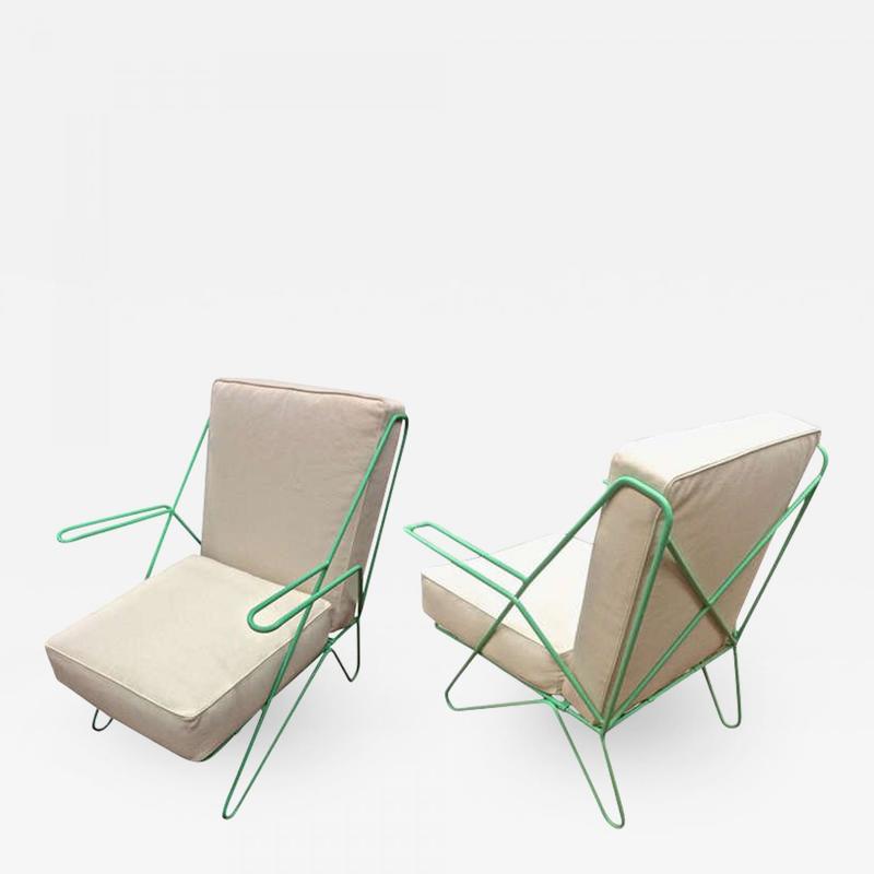 Raoul Guys pair aqua metal chairs