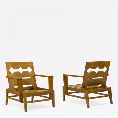 Rene Gabriel rarest unseen pair of carved oak lounge chairs