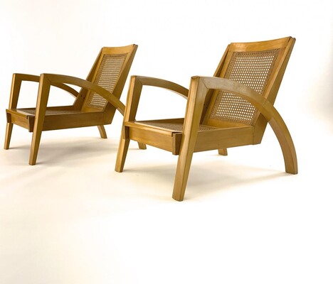 Riviera style pair of blond canned lounge chairs