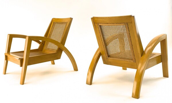 Riviera style pair of blond canned lounge chairs
